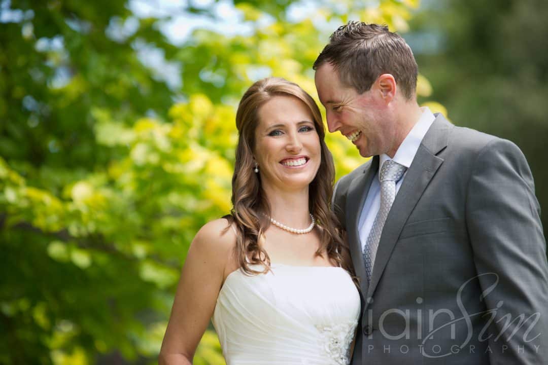 Groom looking at beautiful bride