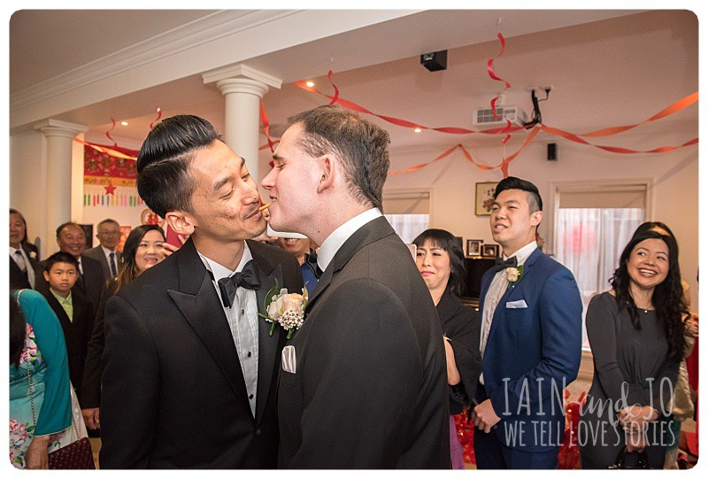 As part of the pre-wedding games, the bridesmaids made the groomsmen 'share' a packet of Pocky sticks without using their hands