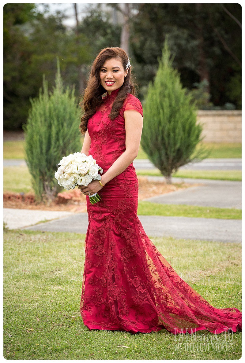 Full-length portrait of the gorgeous bride in the red dress she wore to her tea ceremony