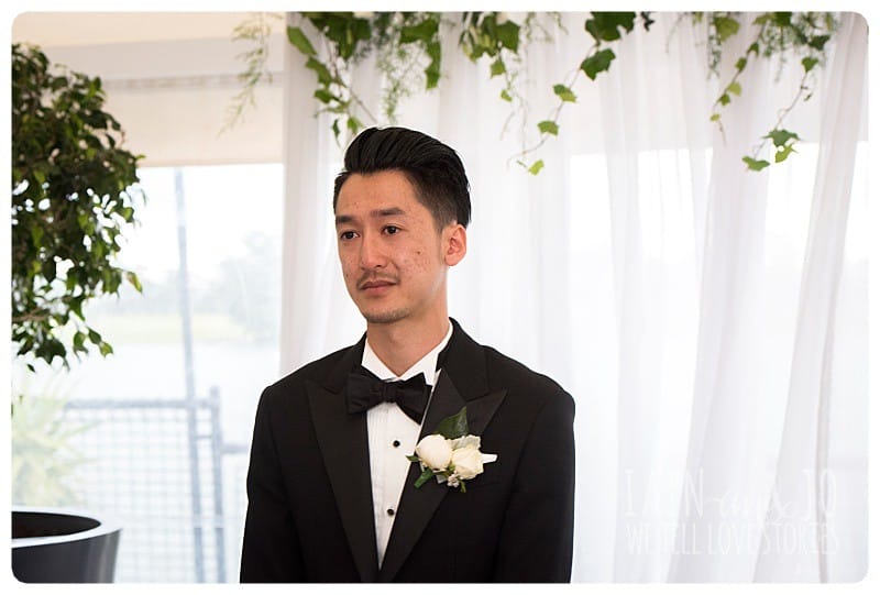 The groom, Duc, seeing his bride walking down the aisle at The Park, Albert Park