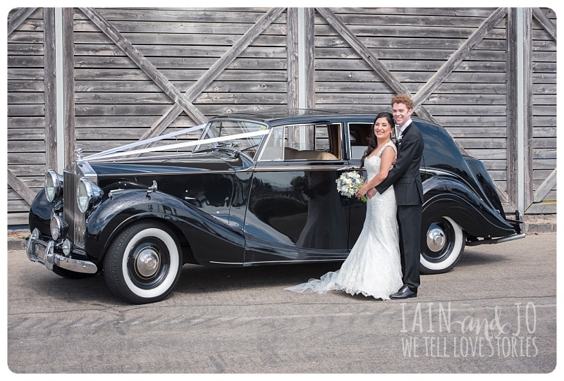 Bride and Groom with Wedding Car