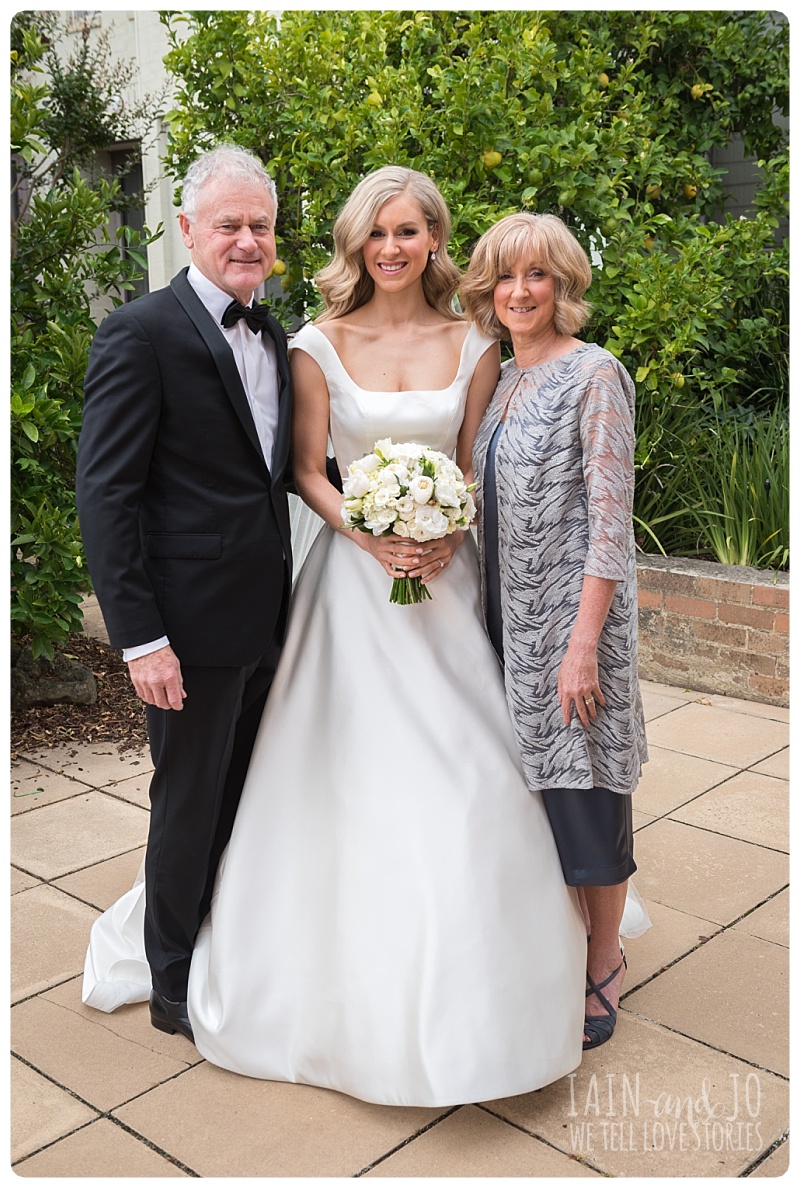 Bride with Her Parents Before The Wedding