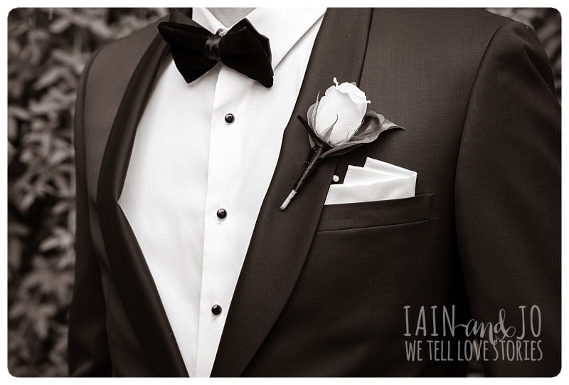 Close-Up Shot of Groom's Coat, Bow and Boutonniere