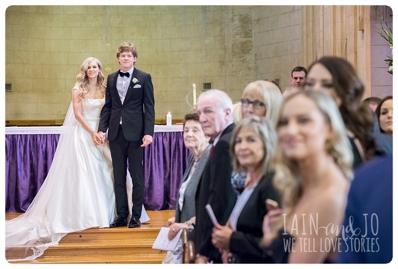 Bride And Groom Watching The Wedding Performers