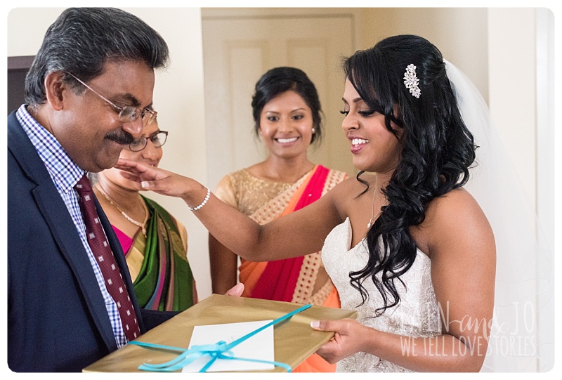 bride giving gift to dad