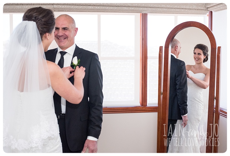 Bride fixes dad's boutonniere