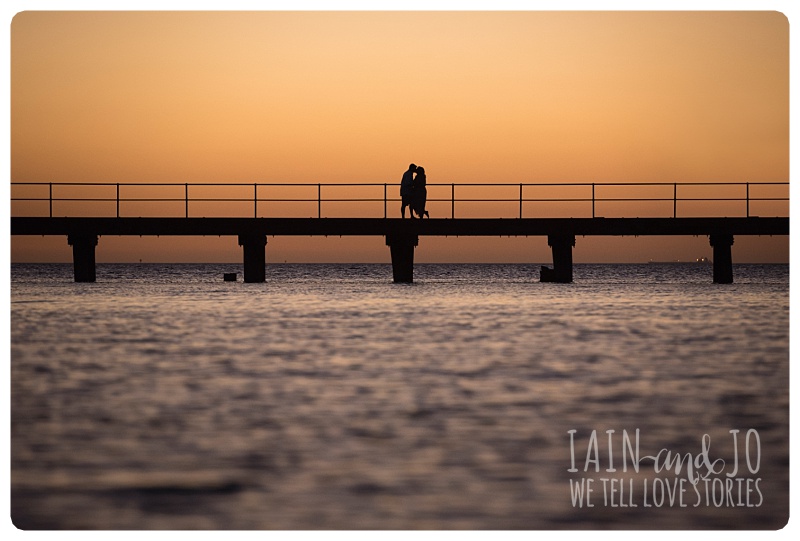 Couple on a bridge during sunset