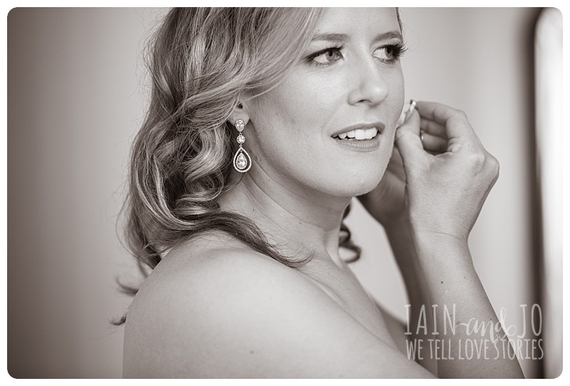 Bride puts on earrings