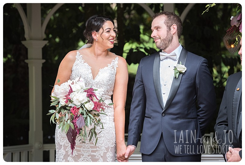 Bride and groom looking at each other