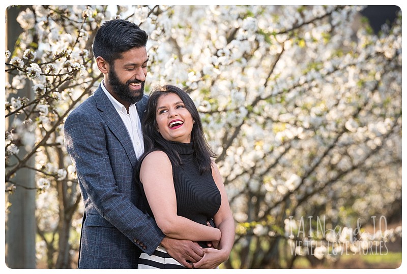 engagement session with cherry blossoms