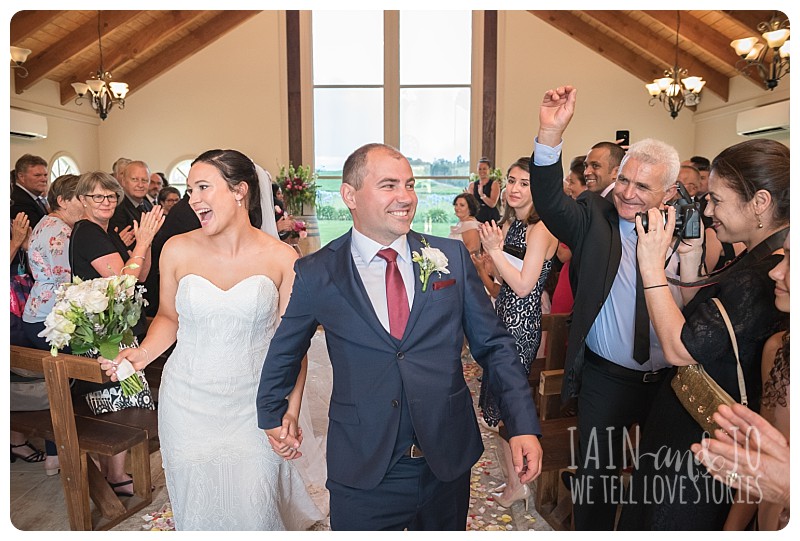 Bride and groom leave chapel