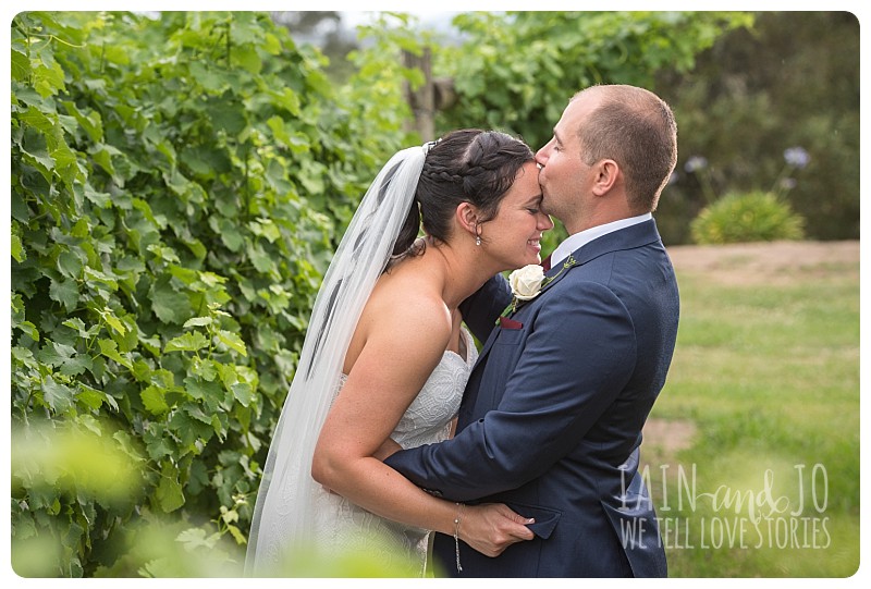 Bride and groom kiss